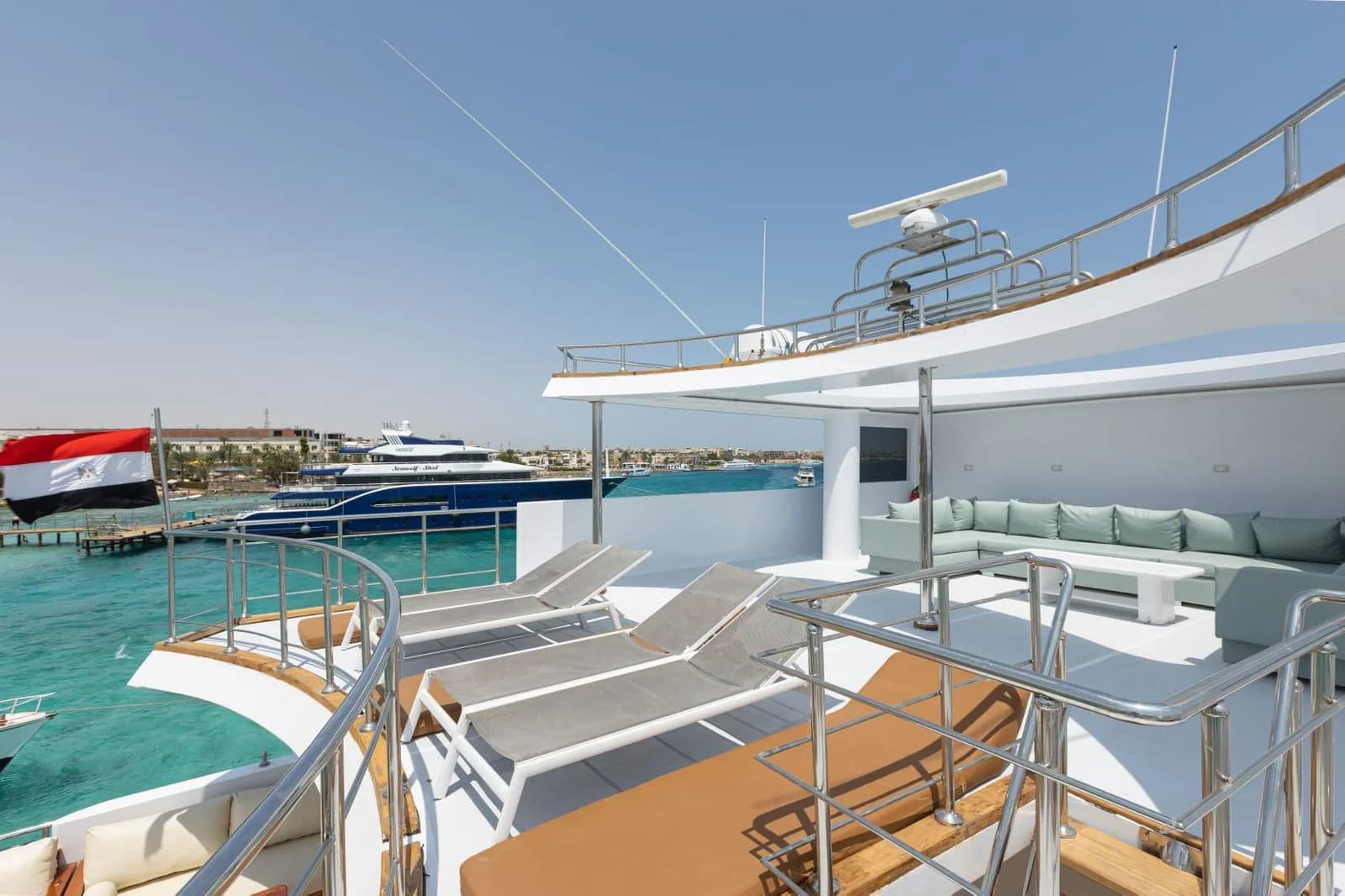 Shaded sun deck with loungers on the liveaboard