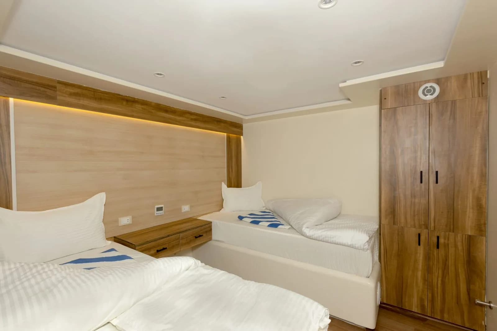 Twin bedded cabin with a sea view window