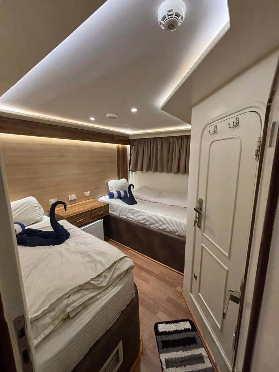 Twin bedded cabin with a sea view window