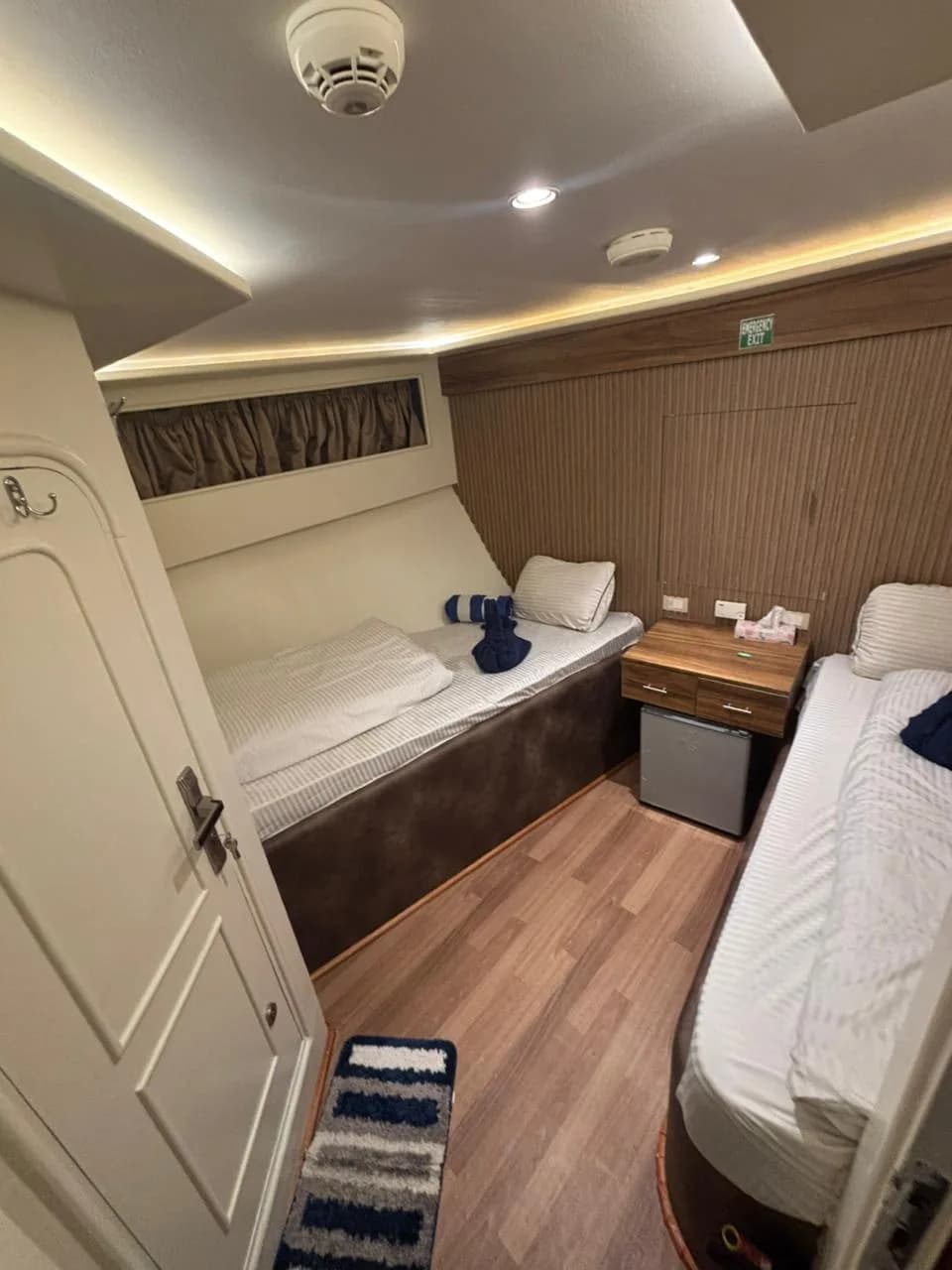 Twin bedded cabin with a sea view window