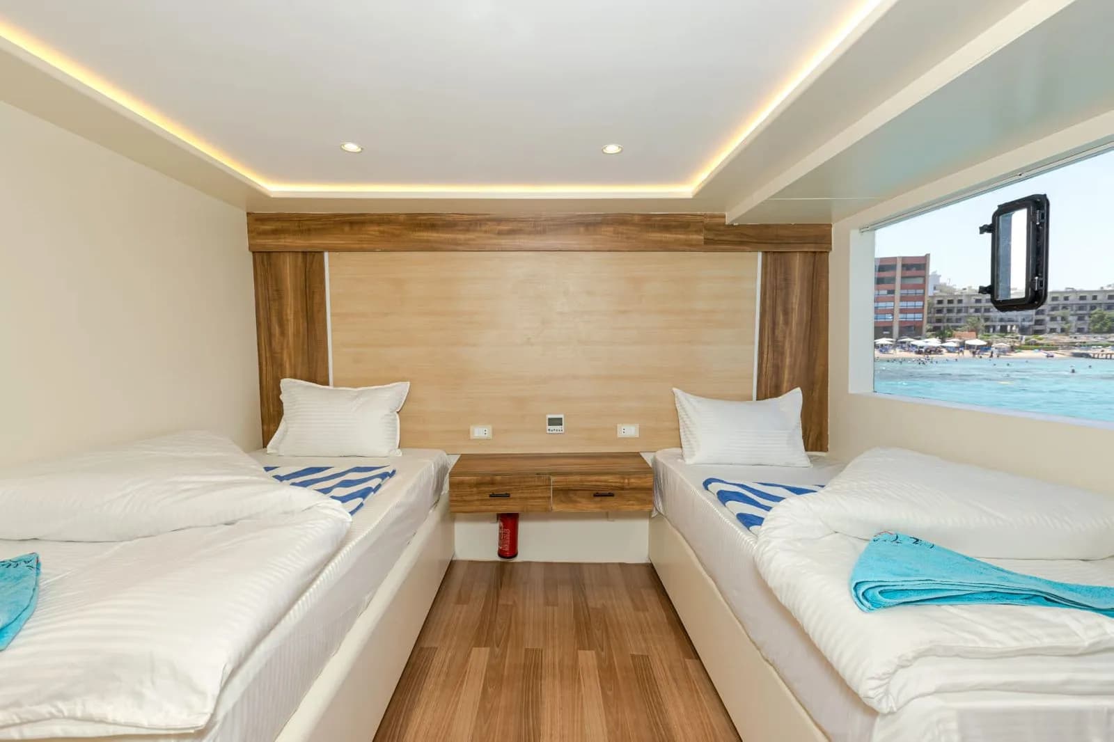 Twin bedded cabin with a sea view window