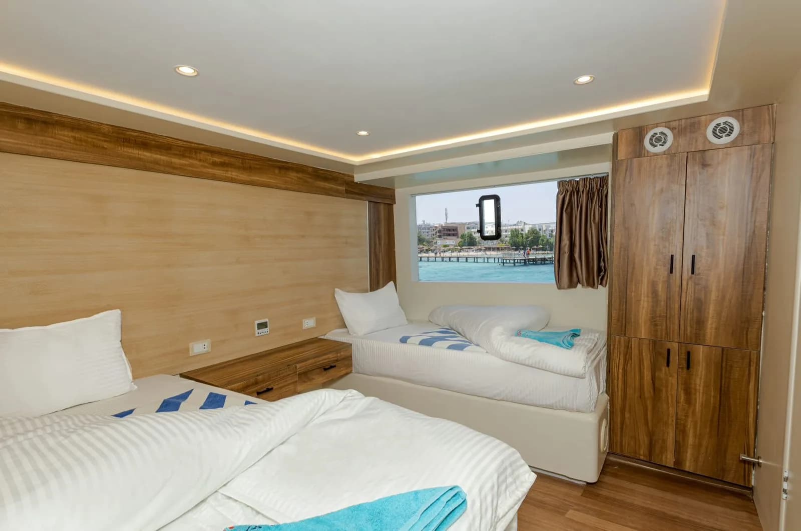 Twin bedded cabin with a sea view window